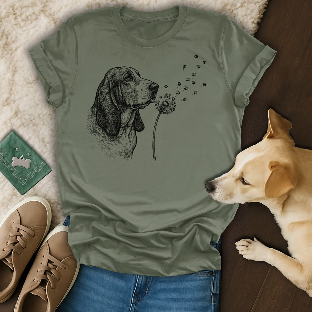 Line drawing of a Basset Hound with dandelion fluff turning into paw prints.