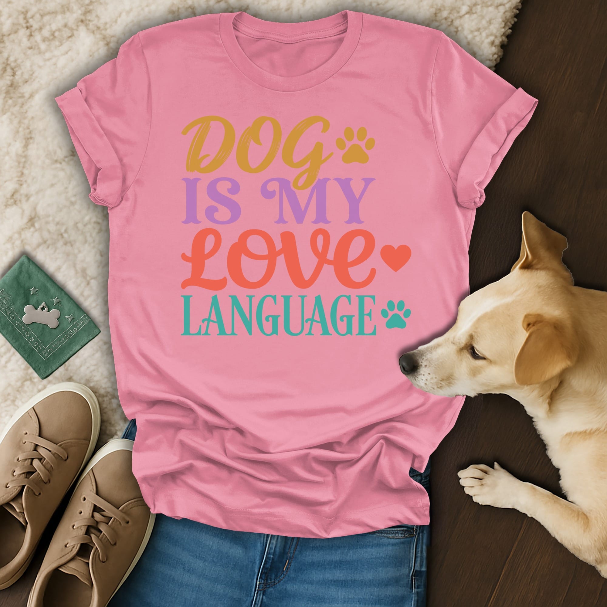 Pink t-shirt with "Dog is my love language" text, pet accessories, and shoes.