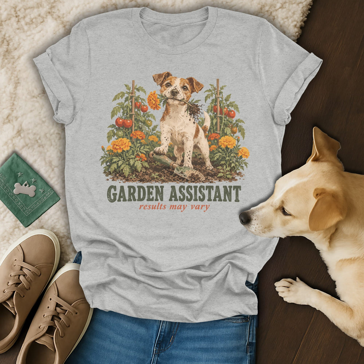 Gray t-shirt featuring a graphic of a Jack Russell terrier in a garden with text reading GARDEN ASSISTANT results may vary.