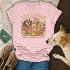 Pink t-shirt with a Late Bloomers Senior Dog Adoption Society graphic featuring three dogs among flowers.