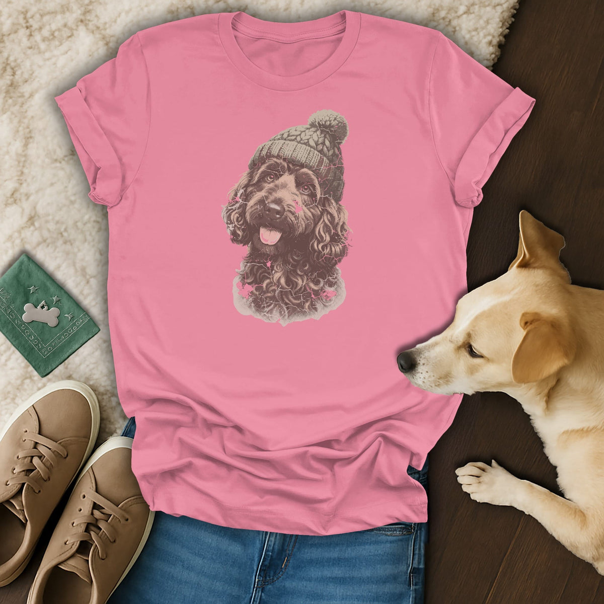 Pink t-shirt with a doodle dog wearing a beanie graphic.