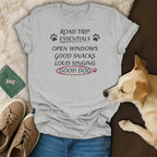 Grey t-shirt with "Road Trip Essentials" and "Good Dog" text, and a dog.