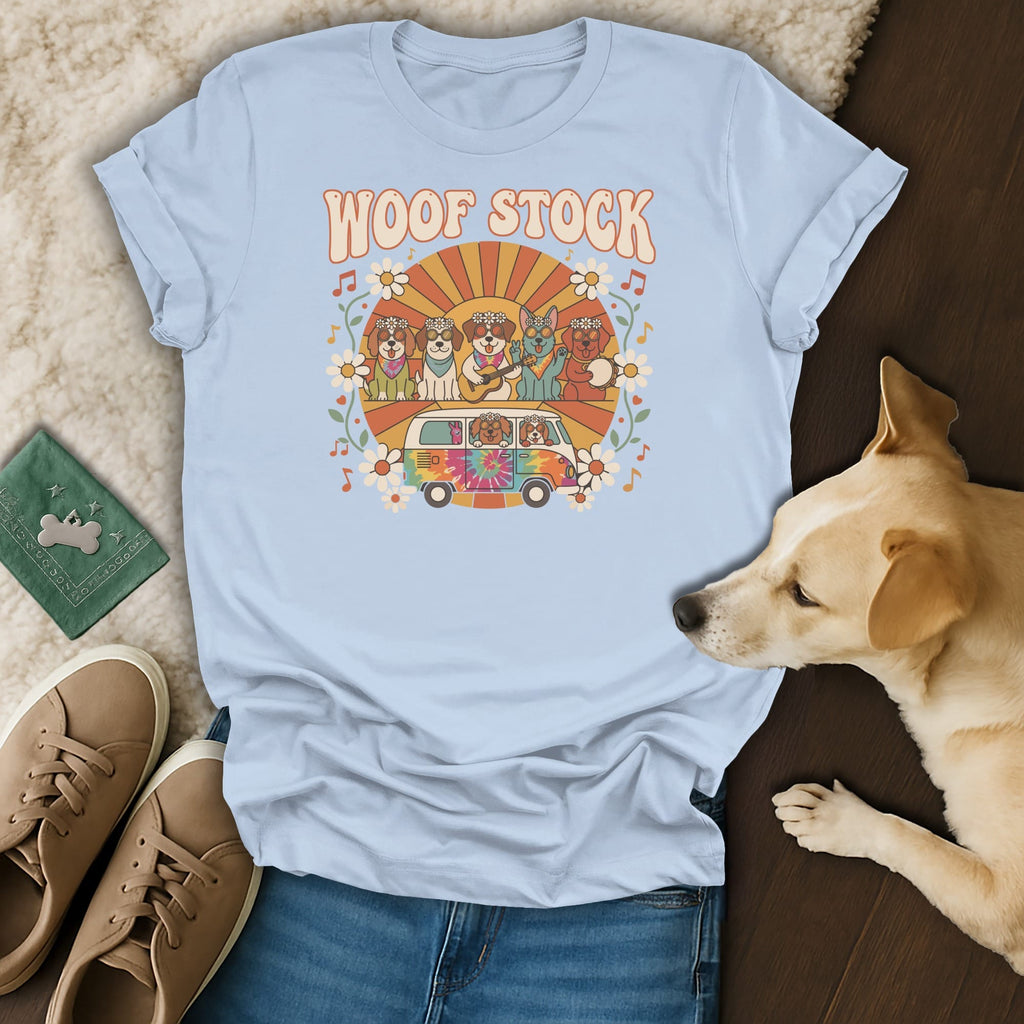 Light blue t-shirt with "Woof Stock" text, dogs in a van, and floral design.