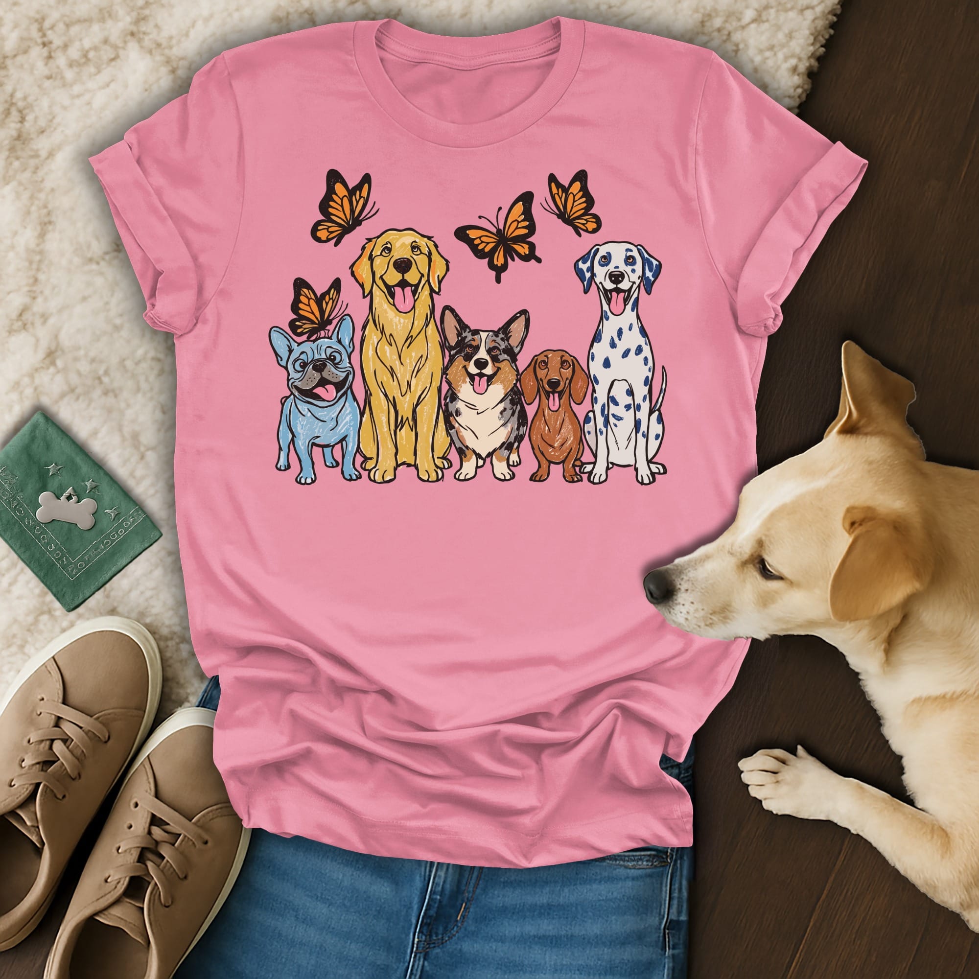 Various dogs with butterflies above on a pink t-shirt.