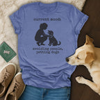 Heathered blue t-shirt with text "current mood: avoiding people, petting dogs" and graphic.