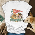 A white v-neck t-shirt featuring a graphic of three dogs and the text Nana's Granddog Fan Club.