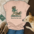 T-shirt with graphic of person and dog walking, text "Born for the trail."