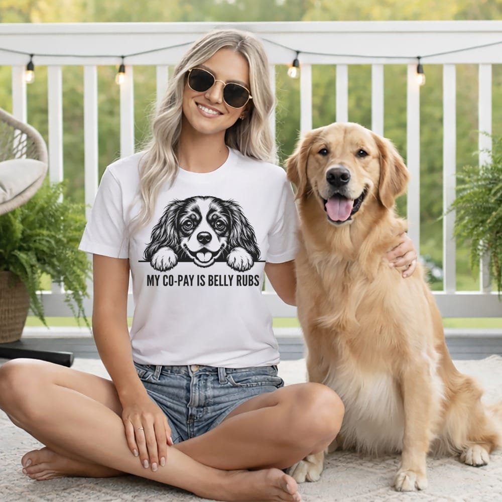 Woman wearing a t-shirt with a dog's face and the text "My co-py is belly rubs".