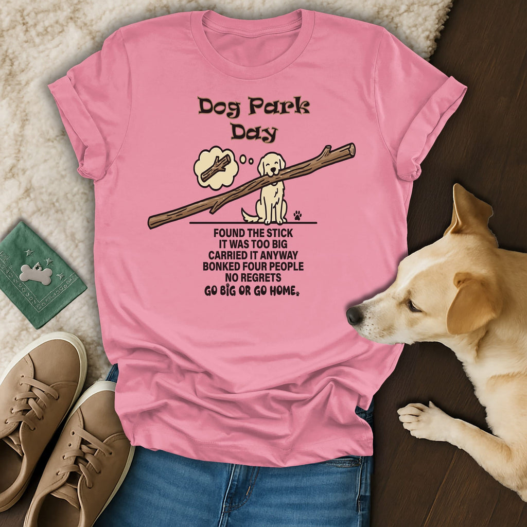 Pink t-shirt with "Dog Park Day" text and illustration of a dog carrying a large stick.