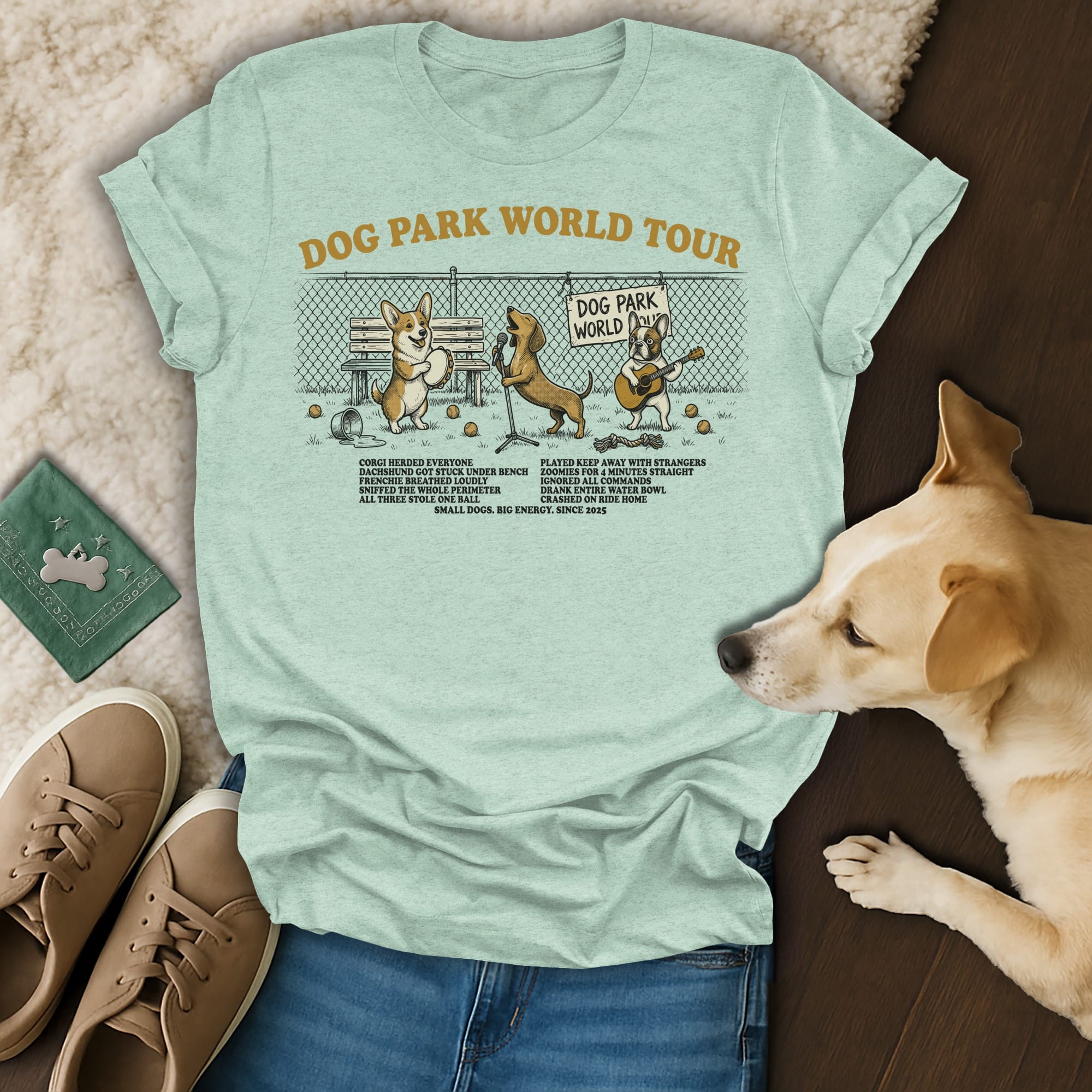 Dog Park World Tour t-shirt with cartoon dogs and text listing park activities.