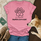 Pink t-shirt with "Pawprints on my Heart" and a paw print heart design.