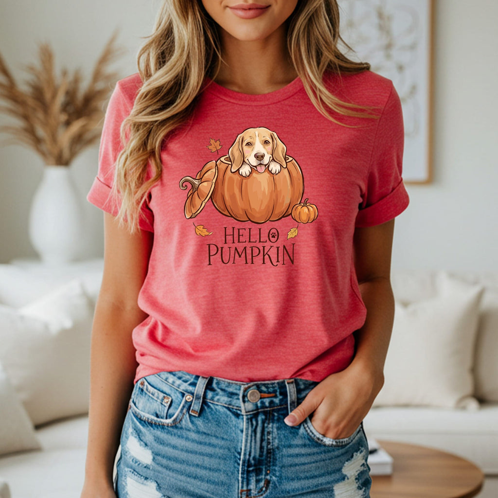 Dog peeking out of pumpkin with "Hello Pumpkin" text on a red t-shirt.