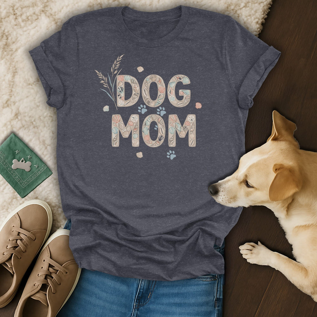 Dark gray t-shirt with "DOG MOM" text made of seashells and paw prints.