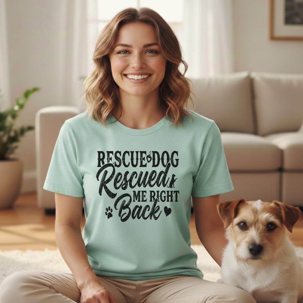 Woman wearing a mint green t-shirt with "Rescue Dog Rescued Me Back" text.