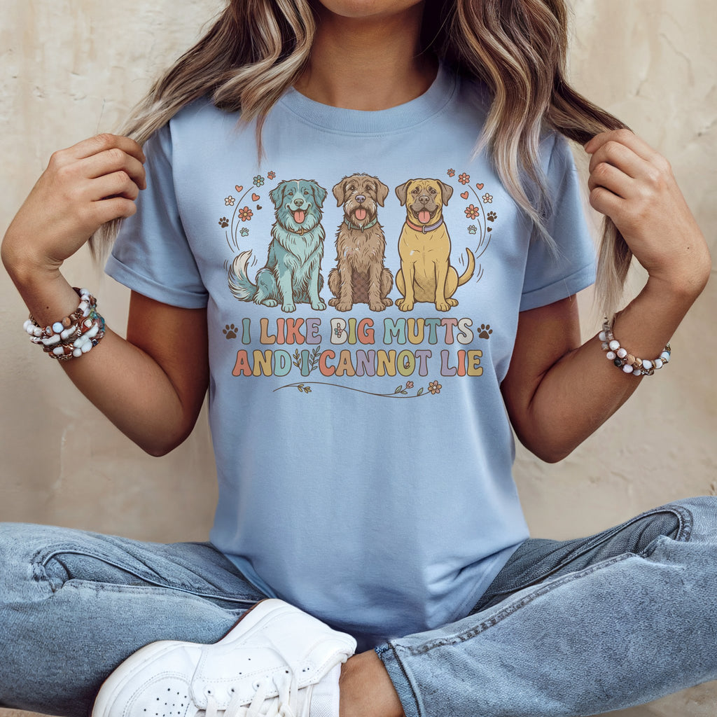 Three dogs sit below the text "I LIKE BIG MUTTS AND I CANNOT LIE".