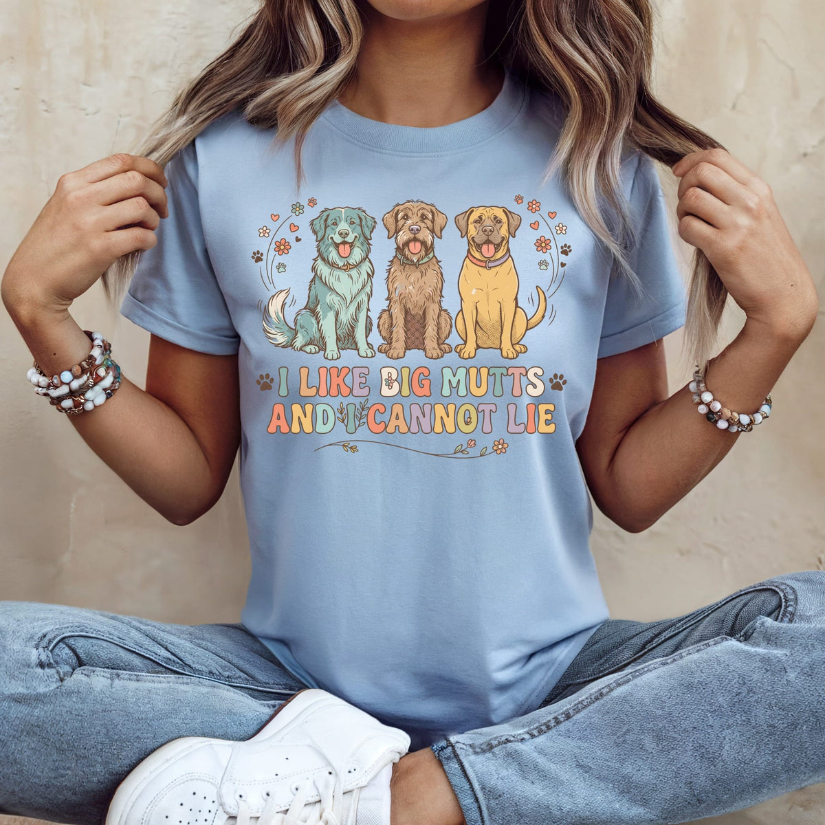 Three dogs sit below the text "I LIKE BIG MUTTS AND I CANNOT LIE".