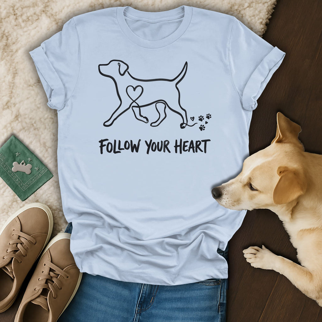 Light blue t-shirt with black dog outline and "Follow Your Heart" text.
