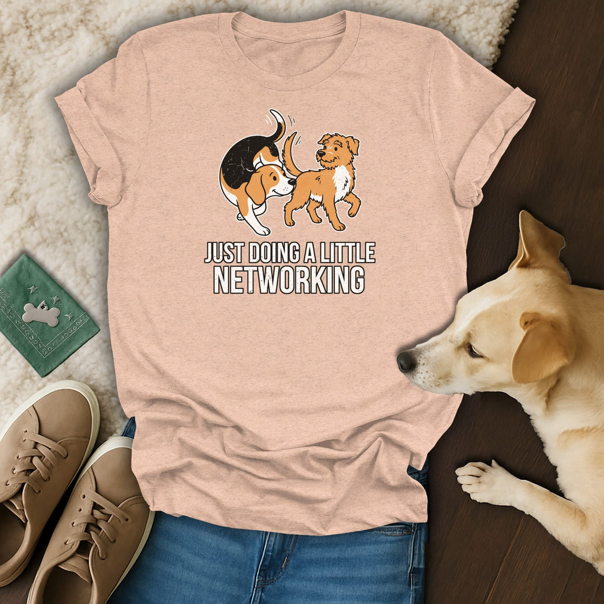Peach t-shirt with cartoon dogs and text "JUST DOING A LITTLE NETWORKING".