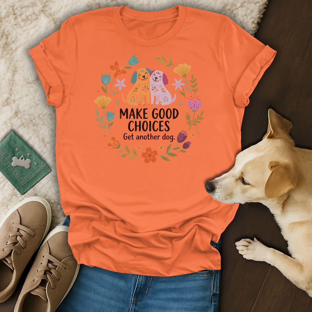 Orange t-shirt with two cartoon dogs and floral wreath, text reads "MAKE GOOD CHOICES Get another dog."