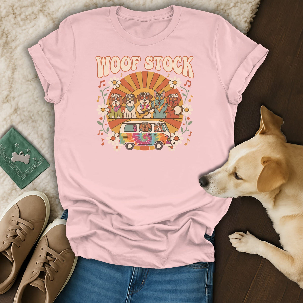 Pink t-shirt with "Woof Stock" text and dogs in a tie-dye van.
