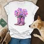 White t-shirt with watercolor boots and paw print flowers.