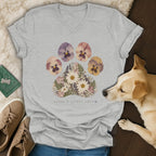 Heather gray v-neck t-shirt featuring a floral paw print graphic with the text leave a little love.