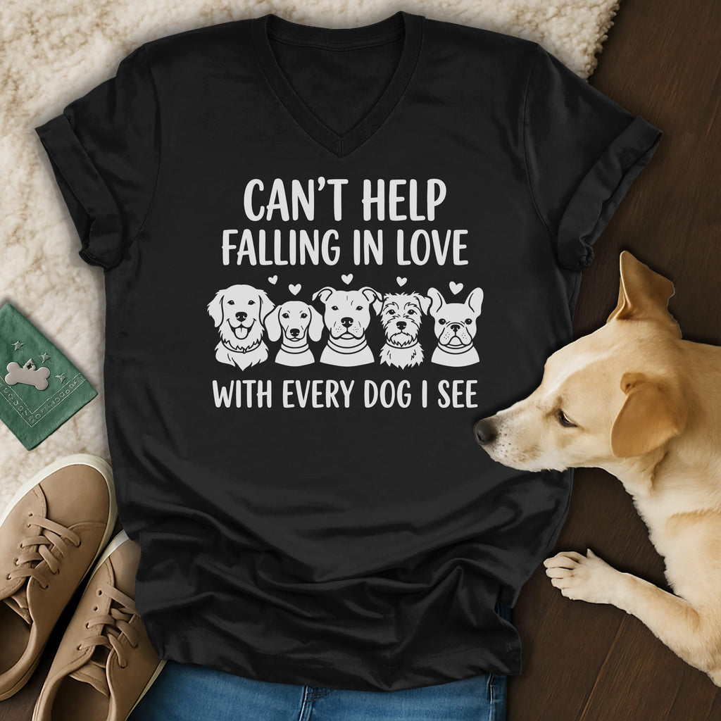 Black v-neck t-shirt with white text "CAN'T HELP FALLING IN LOVE WITH EVERY DOG I SEE".