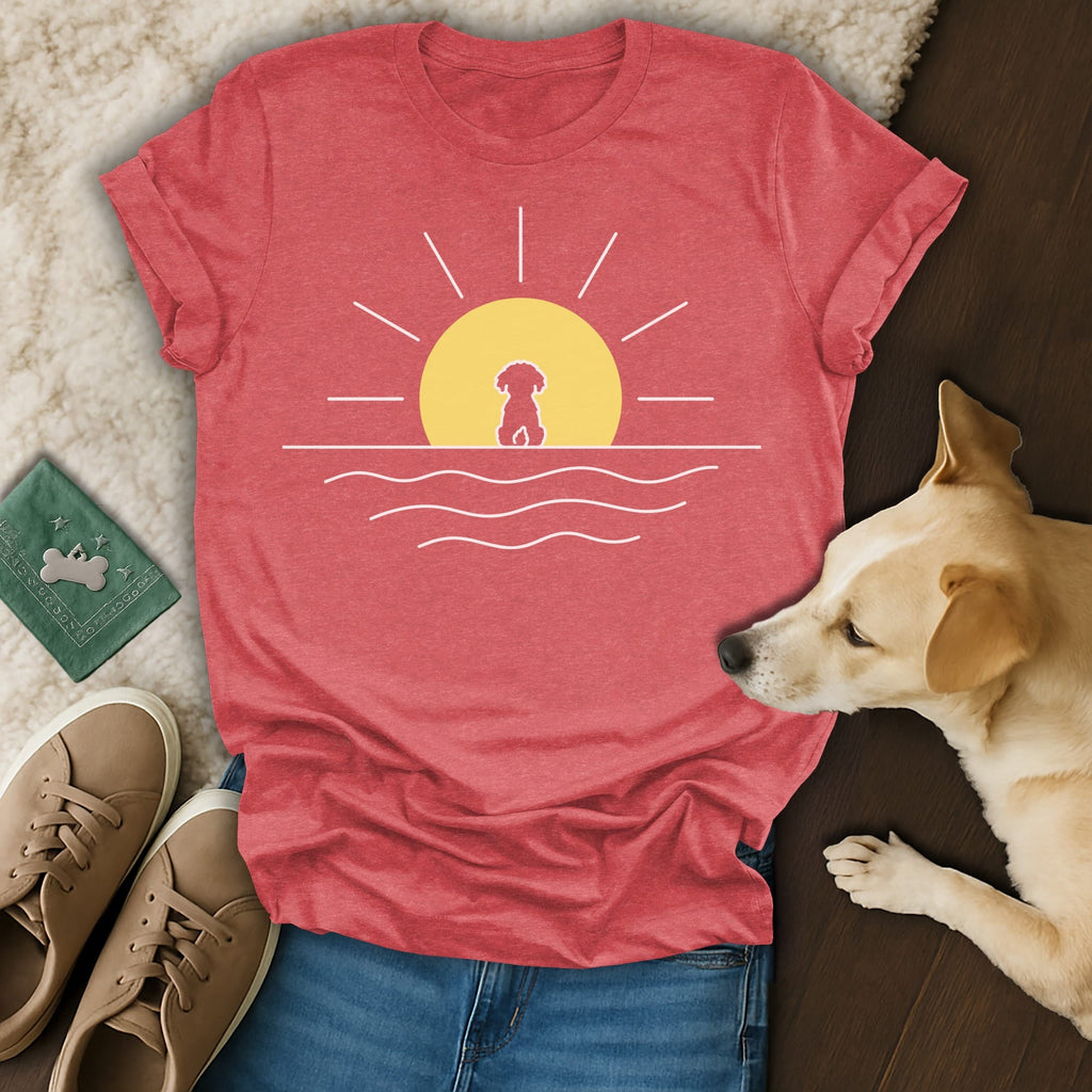 Red t-shirt with a minimalist sun and dog graphic over water.