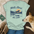 Light blue t-shirt with "Mutts About the Lake" graphic of dog jumping over water.