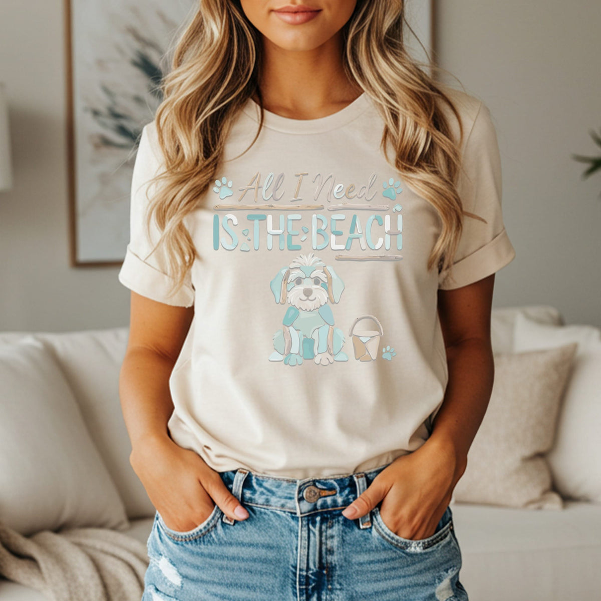 Cream t-shirt with graphic of a dog and text "All I Need Is The Beach".