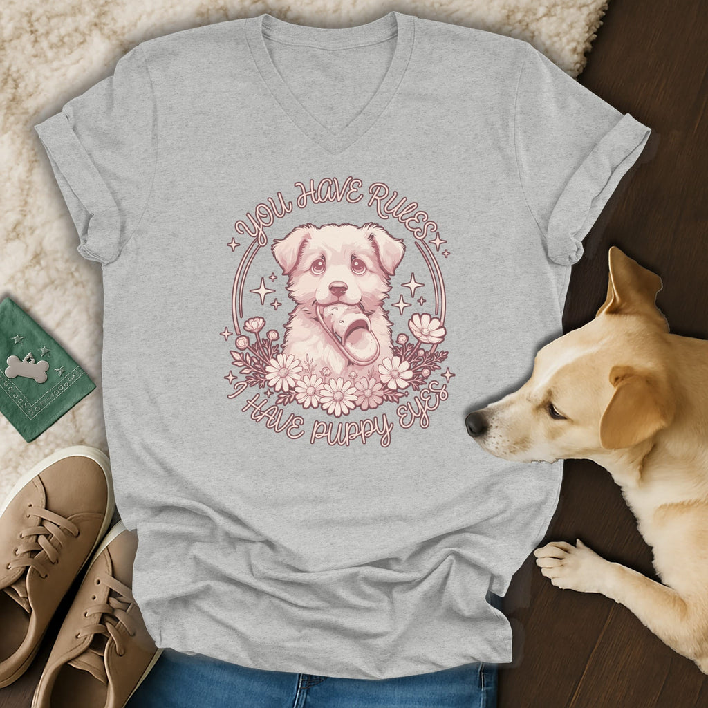 Heather gray V-neck t-shirt featuring a pink puppy illustration and the text You Have Rules I Have Puppy Eyes.