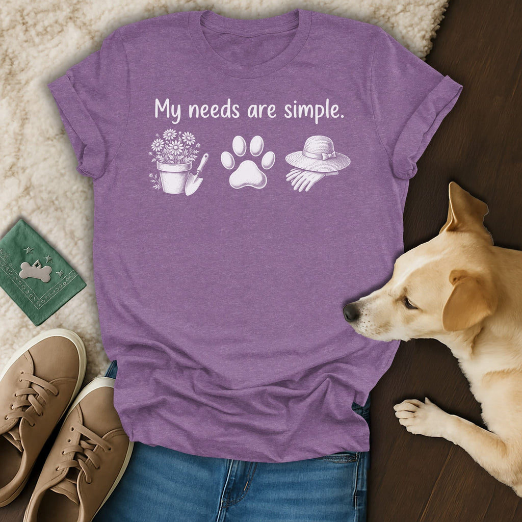 Purple t-shirt with "My needs are simple" text, flowers, paw print, and gardening hat.