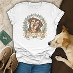 White t-shirt with a vintage illustration of a senior dog and blue flowers, printed with "Forget Me Not".