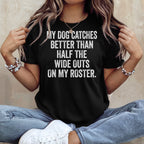 Black t-shirt with white text: "MY DOG CATCHES BETTER THAN HALF THE WIDE OUTS ON MY ROSTER."