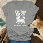 Grey t-shirt with white graphic of dog saying "I'm too sexy for this leash".