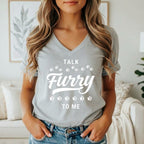 Gray v-neck t-shirt with white text "Talk Furry To Me" and paw prints.
