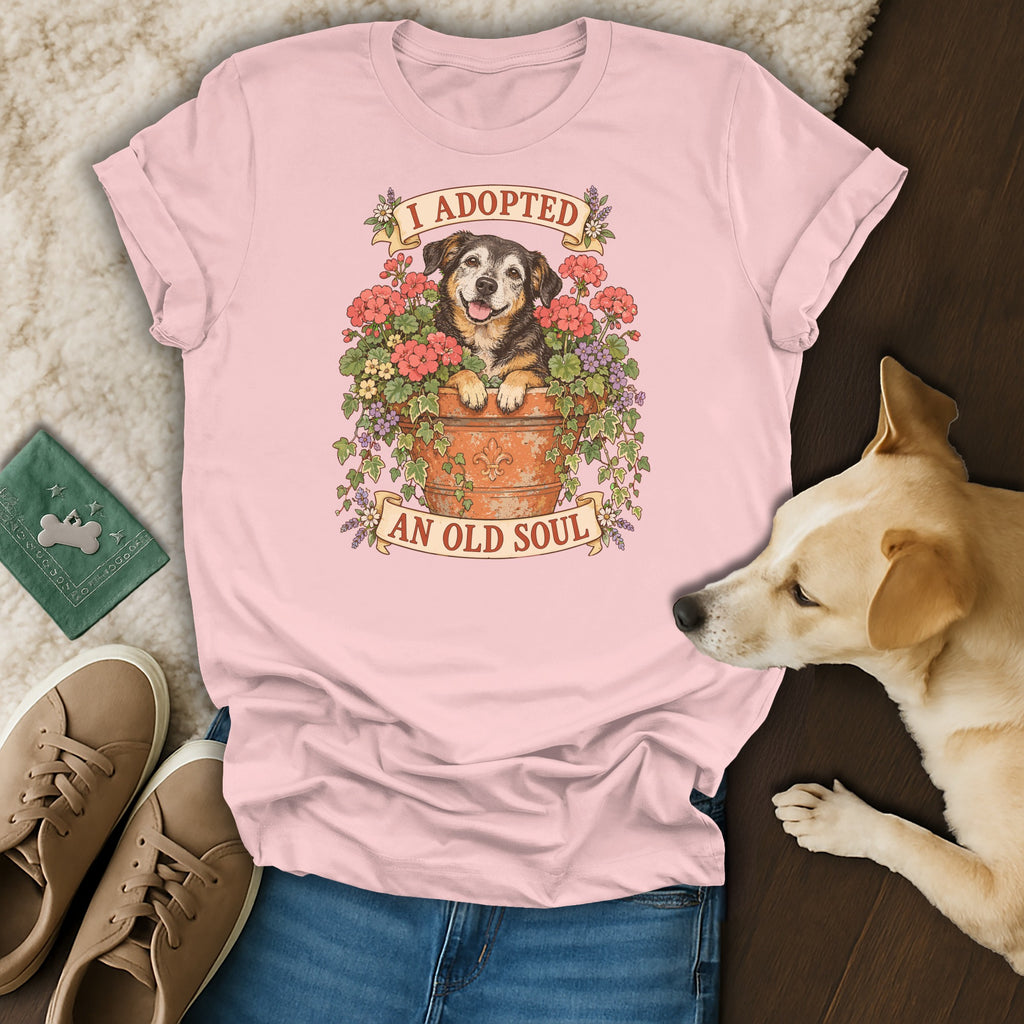 Pink t-shirt with a vintage illustration of a dog in a flower pot and text reading I adopted an old soul.