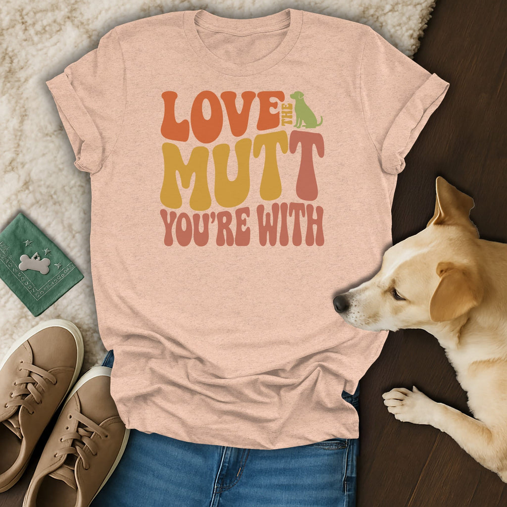 Light pink t-shirt with retro font text "LOVE THE MUTT YOU'RE WITH" and green dog silhouette.
