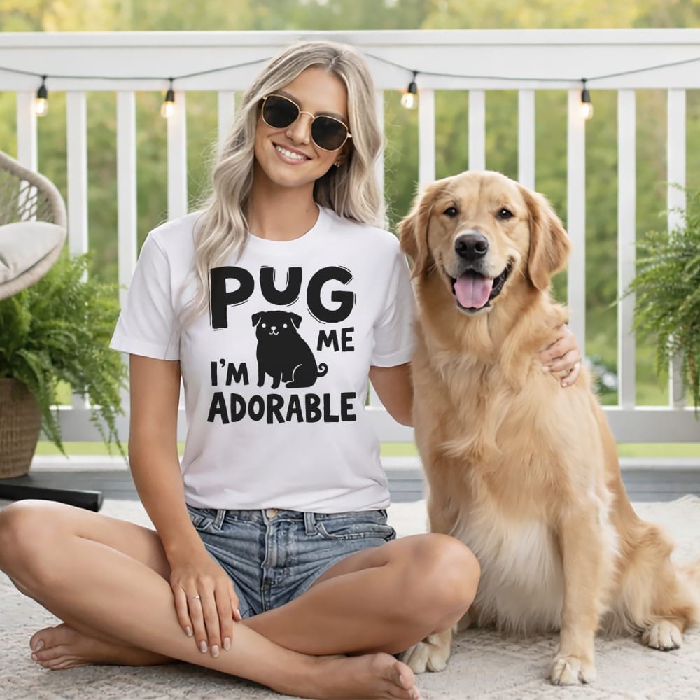 Woman and golden retriever wearing a "Pug me I'm adorable" t-shirt.