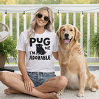 Woman and golden retriever wearing a "Pug me I'm adorable" t-shirt.