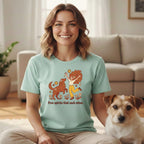 Woman and dog wearing graphic t-shirt with text "Free spirits find each other."