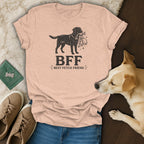 Peach t-shirt with black dog graphic holding fetch toys and text "BFF Best Fetch Friend".
