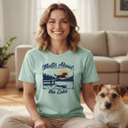 Mint t-shirt with graphic: "Mutts About the Lake," dog jumping over lake.