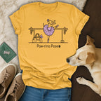 Yellow t-shirt with a dog in a ballet pose with text "Paw-rina Pose".
