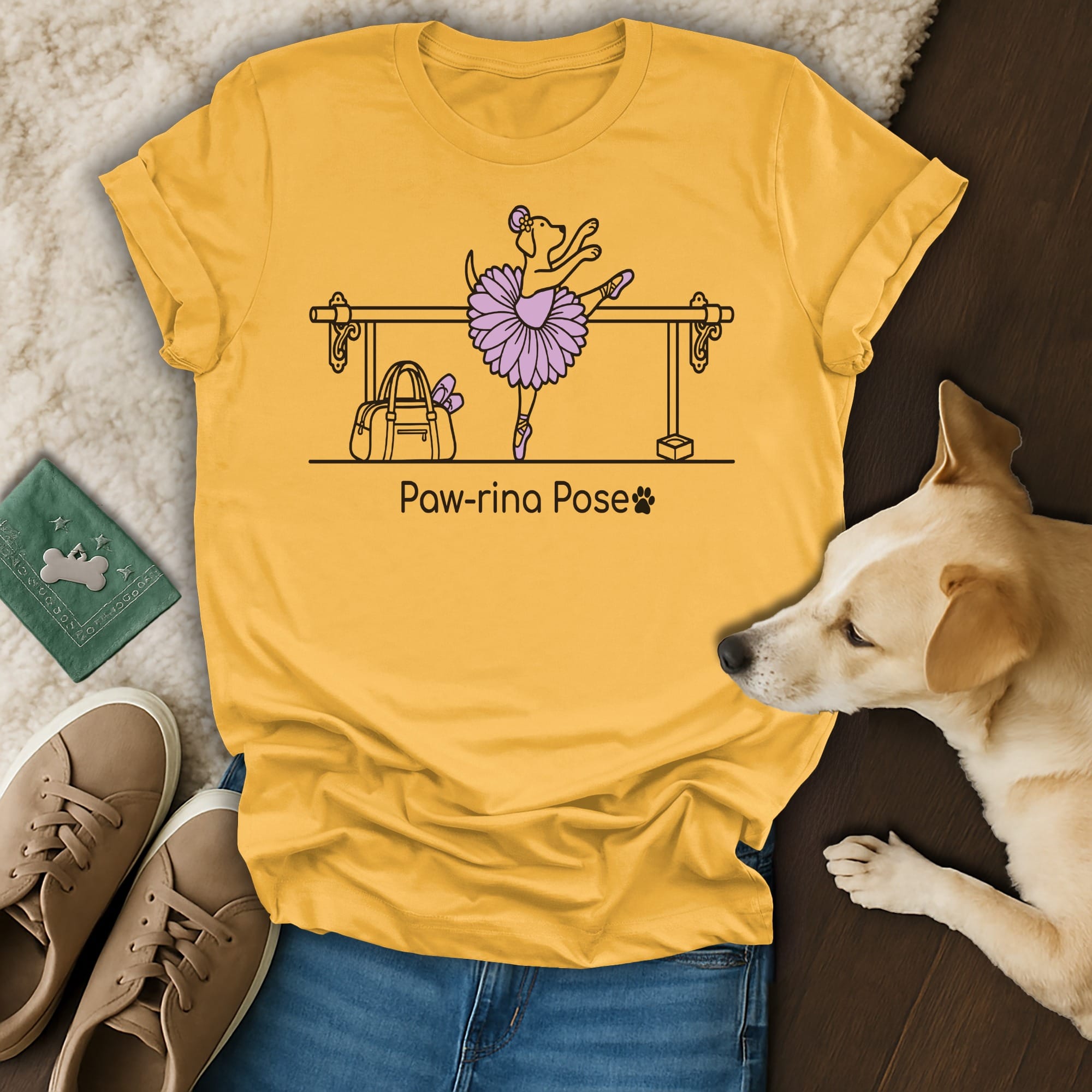 Yellow t-shirt with a dog in a ballet pose with text "Paw-rina Pose".