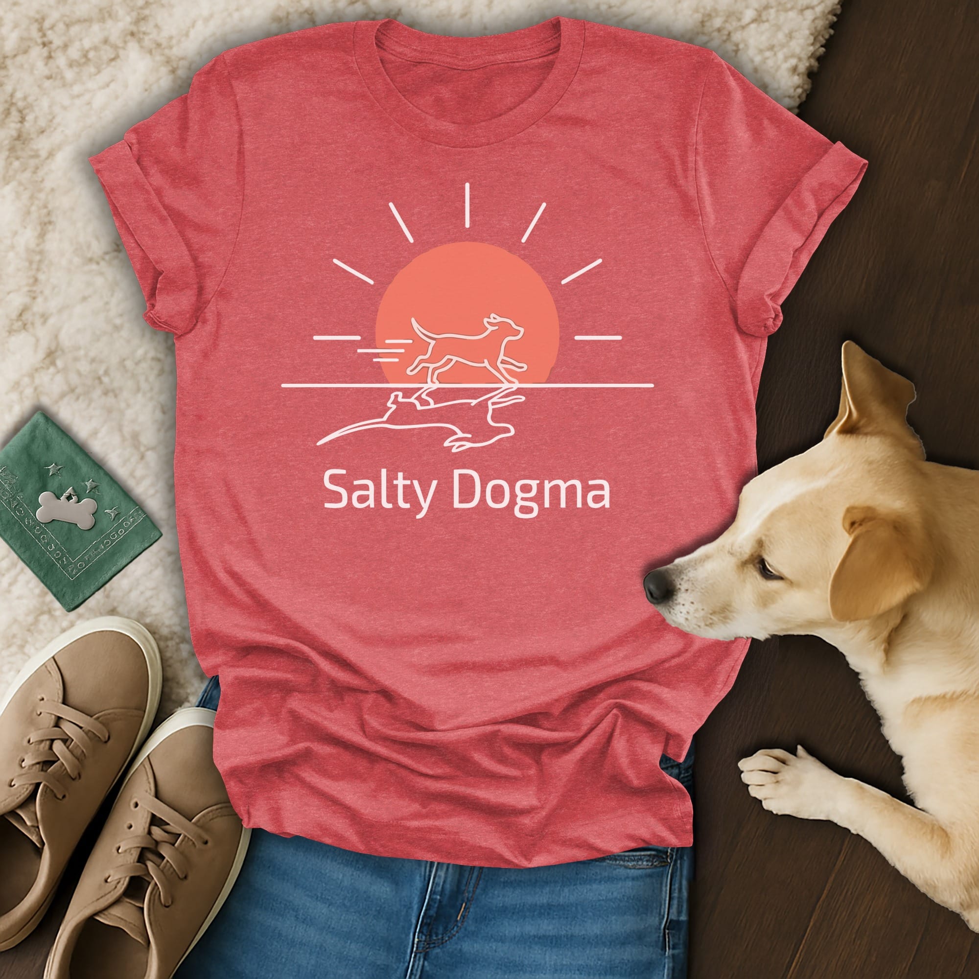 T-shirt with Salty Dogma logo featuring a sun and dogs running.