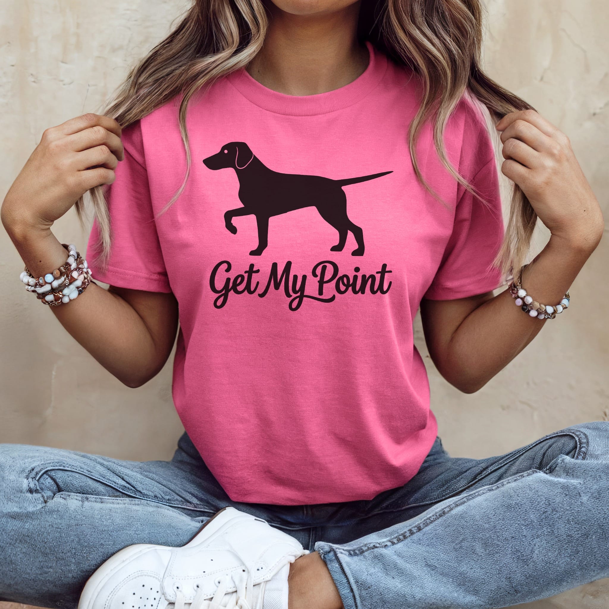 Pink t-shirt with a dog silhouette and "Get My Point" text.