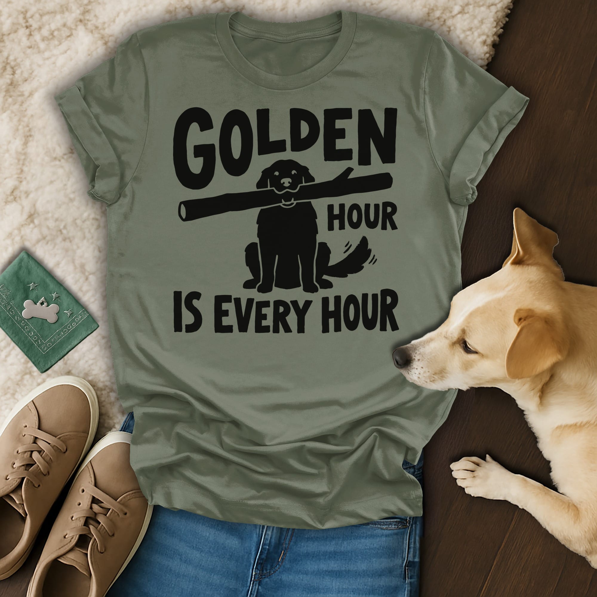 Olive green t-shirt with black text and dog silhouette holding stick.