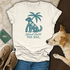 Cream t-shirt with teal dog and palm tree graphic, "Island Heart DOG SOUL" text.