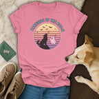 Pink t-shirt with a graphic of a dog howling at a ghost under the text "BARKSIDE OF THE BOO-N".